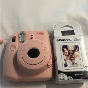 Pink Instax mini camera with film